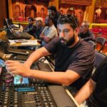 Lighting team programming the show at the grandMA3 console